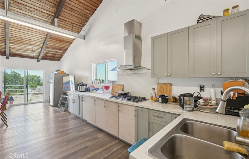 22702 Timbertop Lane Diamond Bar, CA 91765 - Photo 68 of 75 a kitchen that has a lot of cabinets in it and appliances