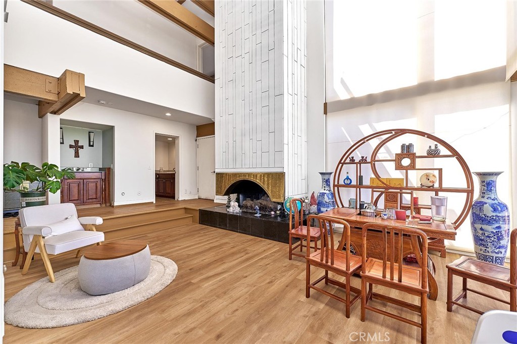 22702 Timbertop Lane Diamond Bar, CA 91765 - Photo 10 of 75 a living room with furniture a fireplace and a large window