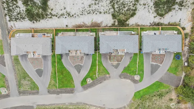an aerial view of a house with outdoor space
