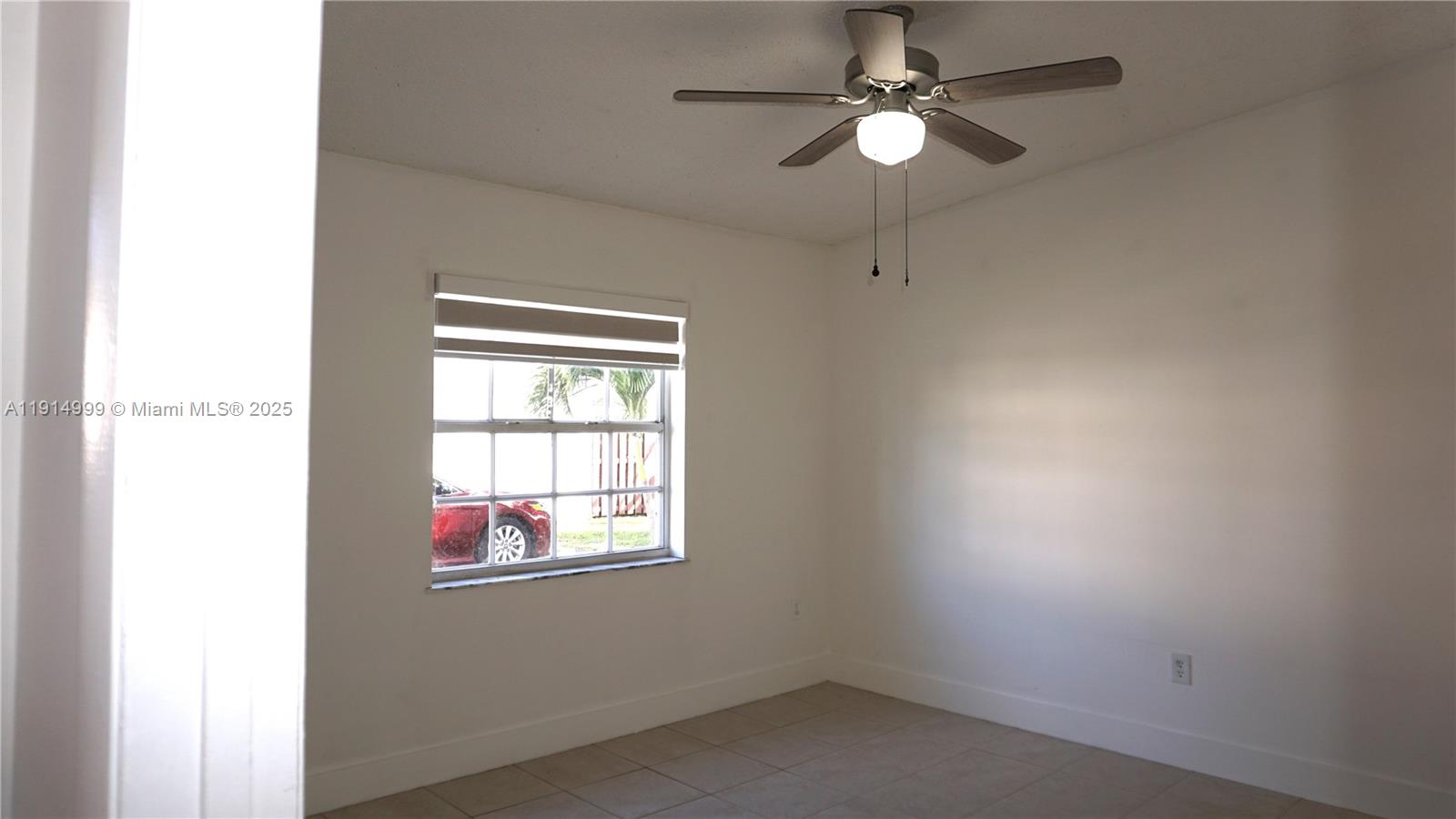 13479 Southwest 62nd Street Miami, FL 33183 - Photo 13 of 27 an empty room with windows and fan