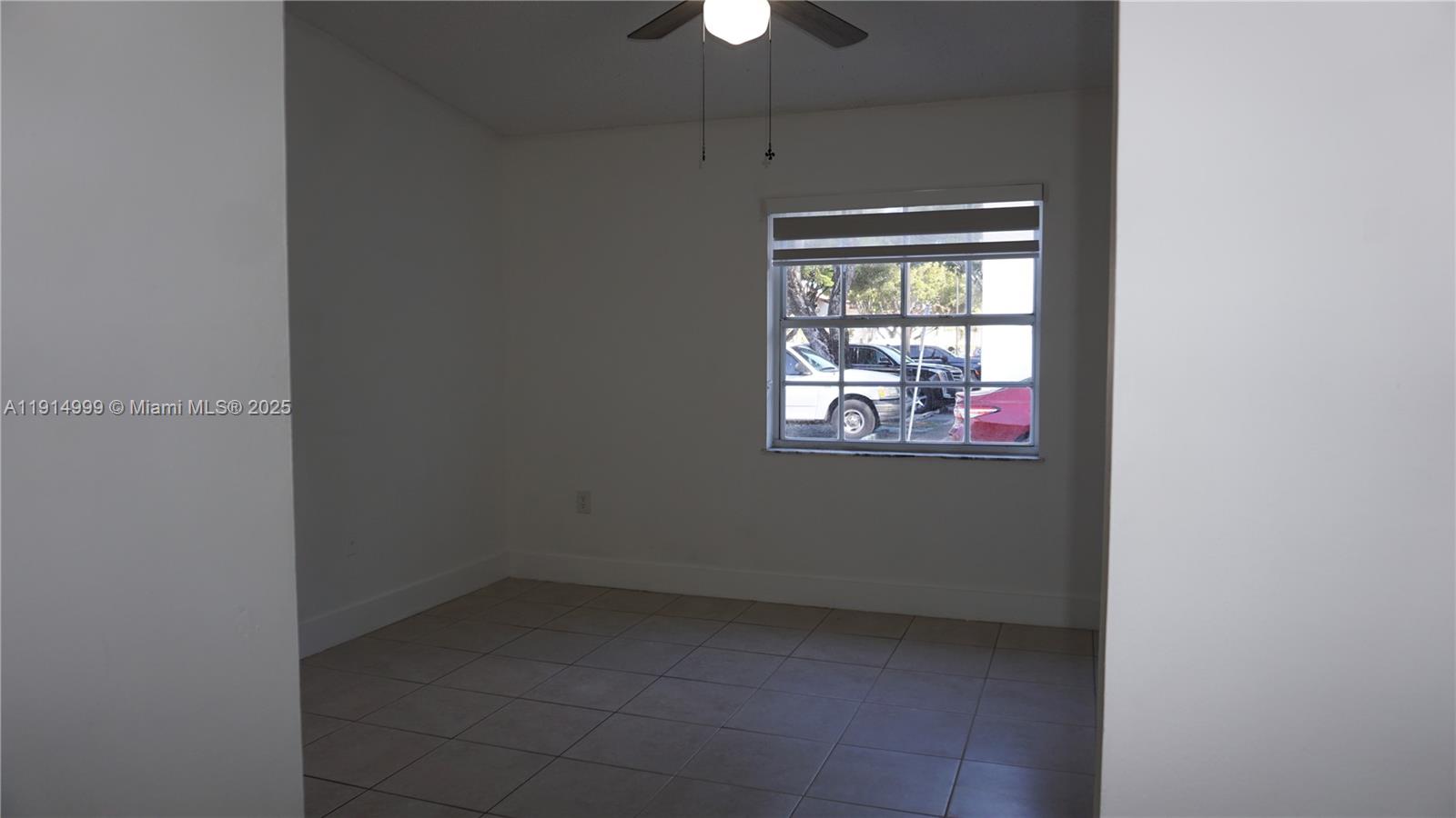 13479 Southwest 62nd Street Miami, FL 33183 - Photo 14 of 27 a view of an empty room with a window