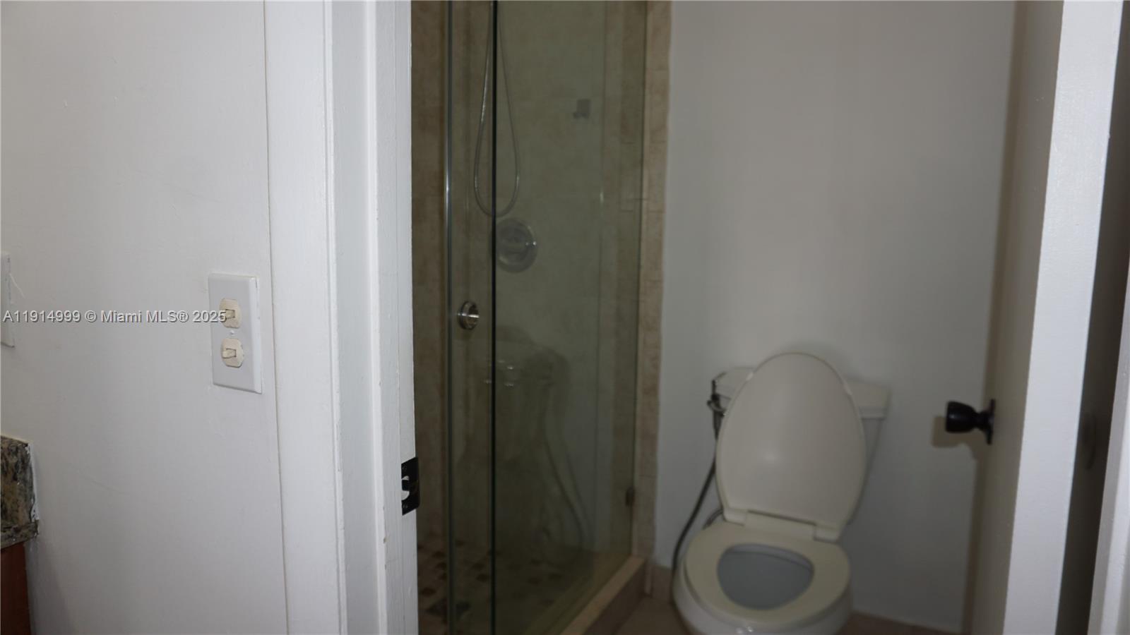 13479 Southwest 62nd Street Miami, FL 33183 - Photo 16 of 27 a bathroom with a granite countertop toilet and a sink