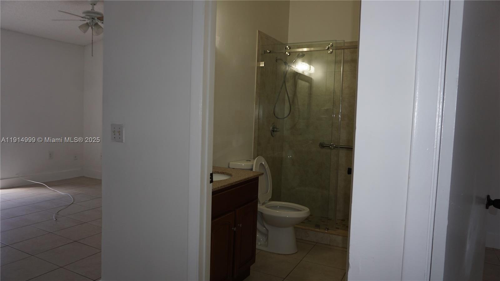 13479 Southwest 62nd Street Miami, FL 33183 - Photo 18 of 27 a bathroom with a toilet and a shower