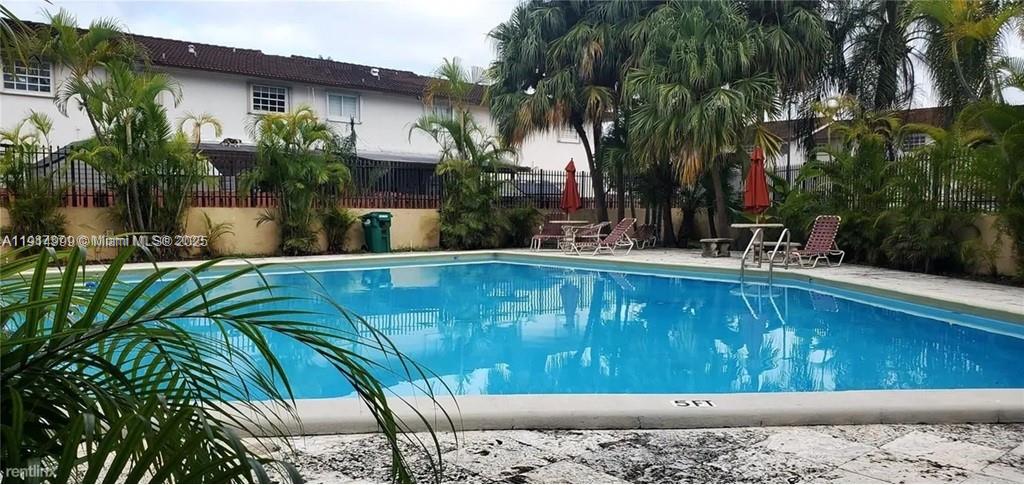 13479 Southwest 62nd Street Miami, FL 33183 - Photo 26 of 27 a view of swimming pool with a patio