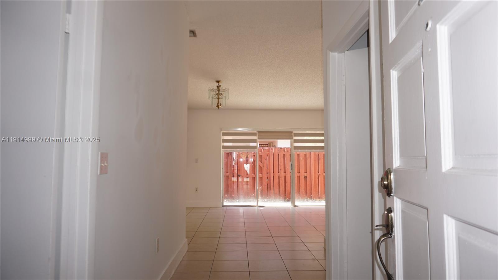 13479 Southwest 62nd Street Miami, FL 33183 - Photo 4 of 27 a view of empty room with wooden floor and fan