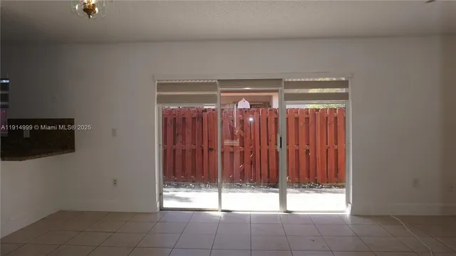 a room with a water heater on the wall