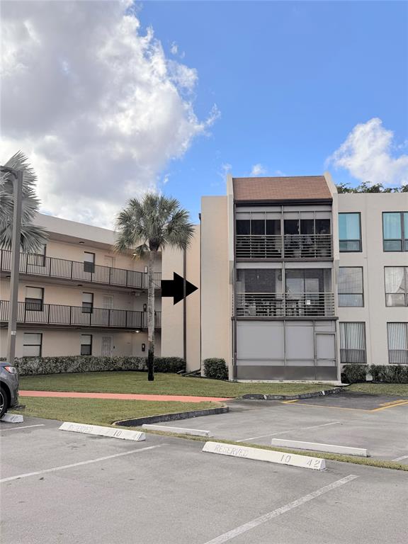 a view of a brick building next to a yard