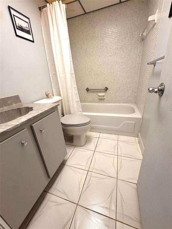 7950 West McNab Road, Unit 203 Tamarac, FL 33321 - Photo 15 of 21 a bathroom with a sink a toilet and shower