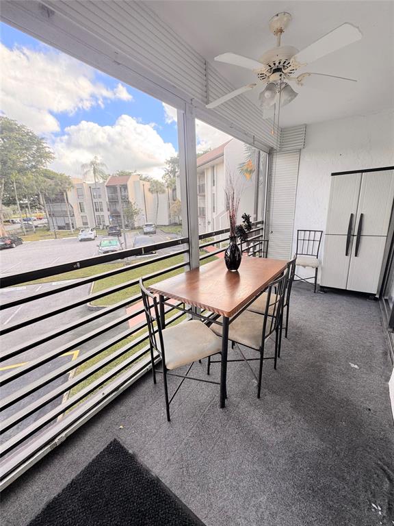 7950 West McNab Road, Unit 203 Tamarac, FL 33321 - Photo 3 of 21 a dining room with furniture and window