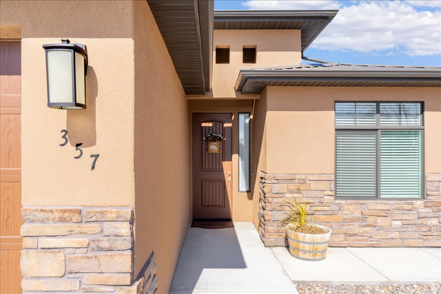 357 East Main Street Enterprise, UT 84725 - Photo 7 of 71 Doorway to property with stone siding and stucco siding