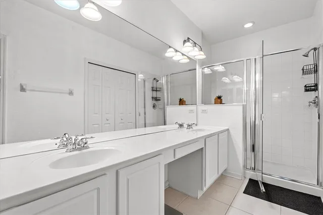 a bathroom with a double vanity sink mirror and double