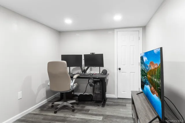 a view of a workspace with furniture