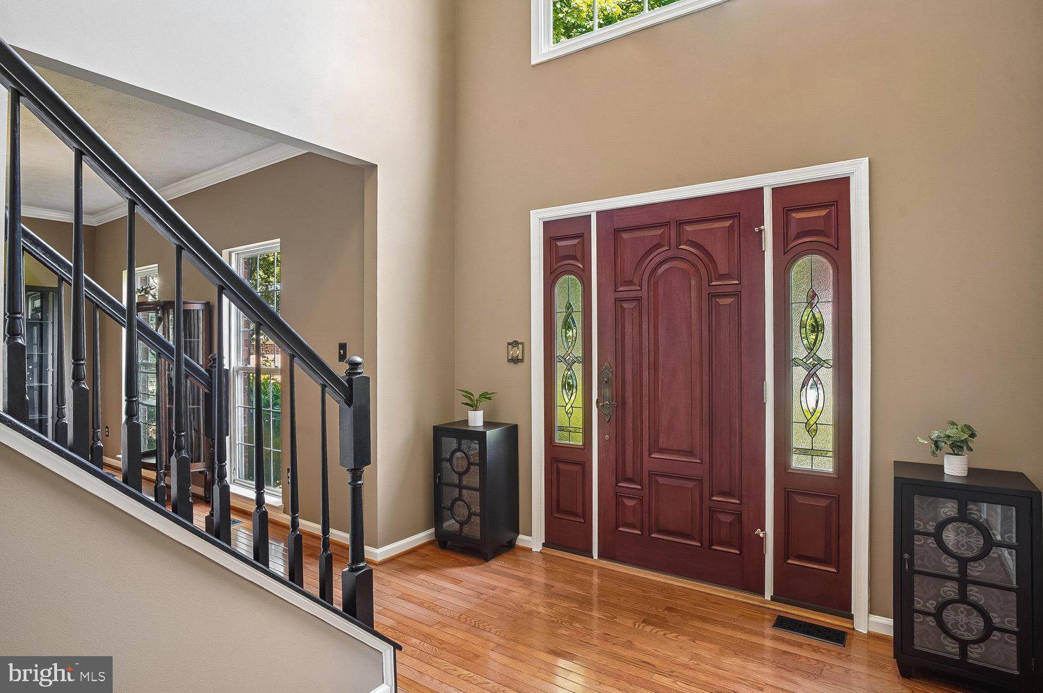 217 Raccoon Run Court Hanover, MD 21076 - Photo 2 of 38 a view of an entryway with wooden floor and stairs
