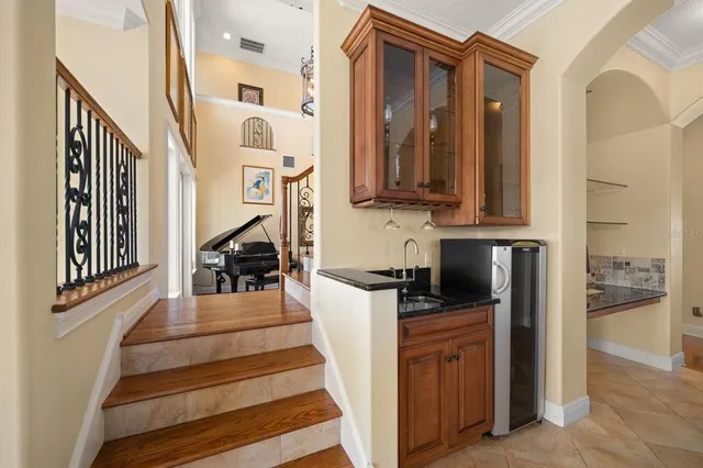 a kitchen with a sink and a stove top oven