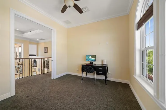 an aerial view of a house with outdoor space and a lake view