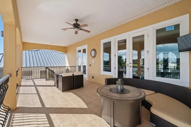 a view of a swimming pool with sitting area