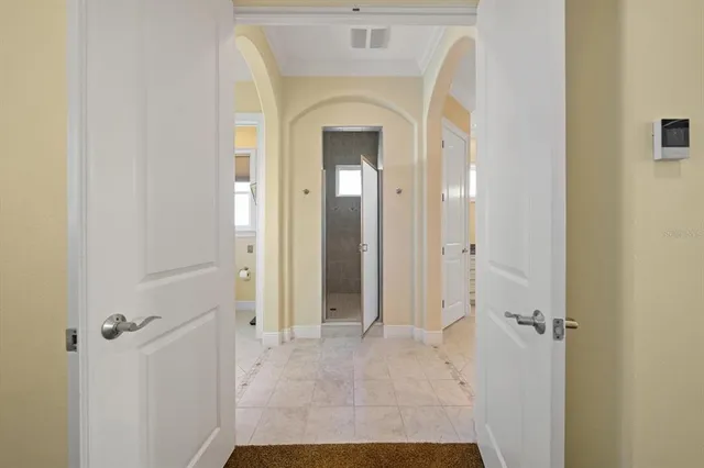 a front view of a house with a garden and yard