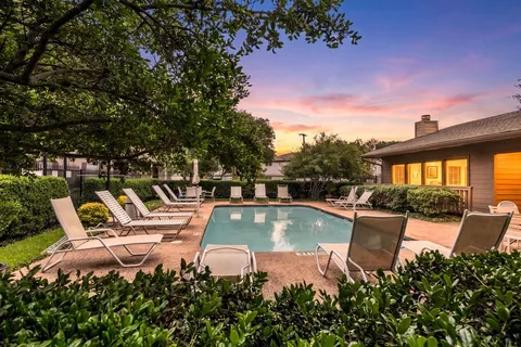a view of a swimming pool with a lounge chairs