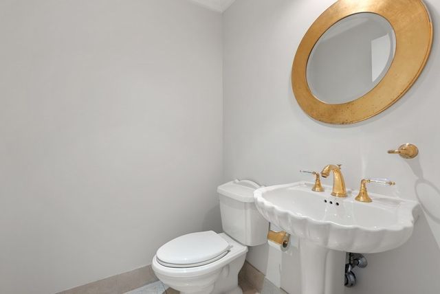 a bedroom with a bed and a chair