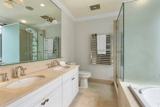 a bath tub sitting in a bathroom next to a window