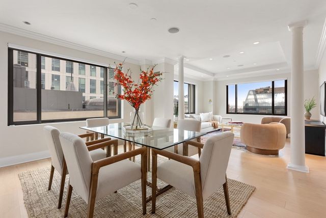 a kitchen with kitchen island granite countertop a sink stove and cabinets