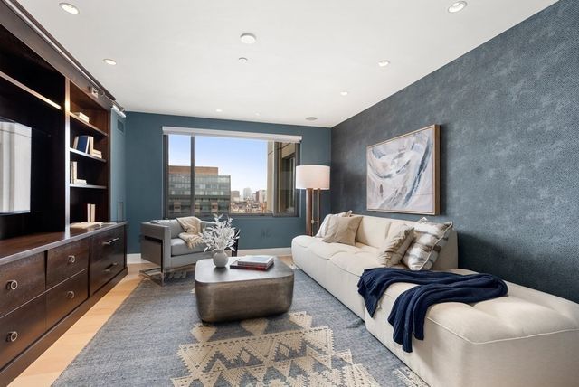 a living room with furniture and a rug