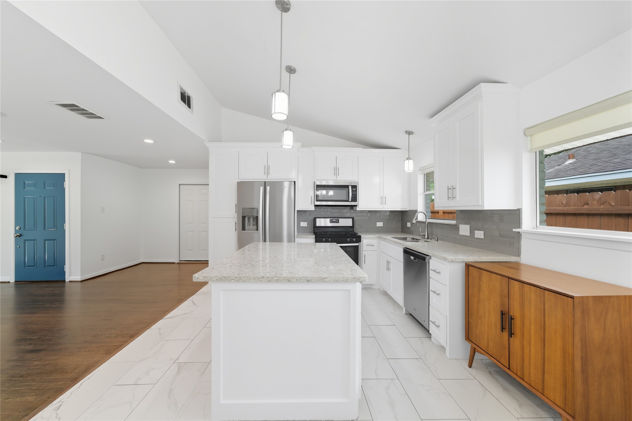 11223 Greenwillow Street Houston, TX 77035 - Photo 12 of 29 a kitchen with stainless steel appliances granite countertop a sink stove and refrigerator