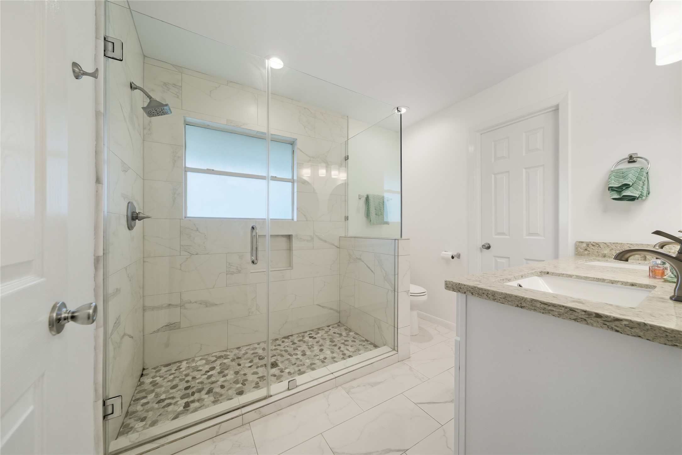 11223 Greenwillow Street Houston, TX 77035 - Photo 15 of 29 a bathroom with a granite countertop sink a shower and mirror