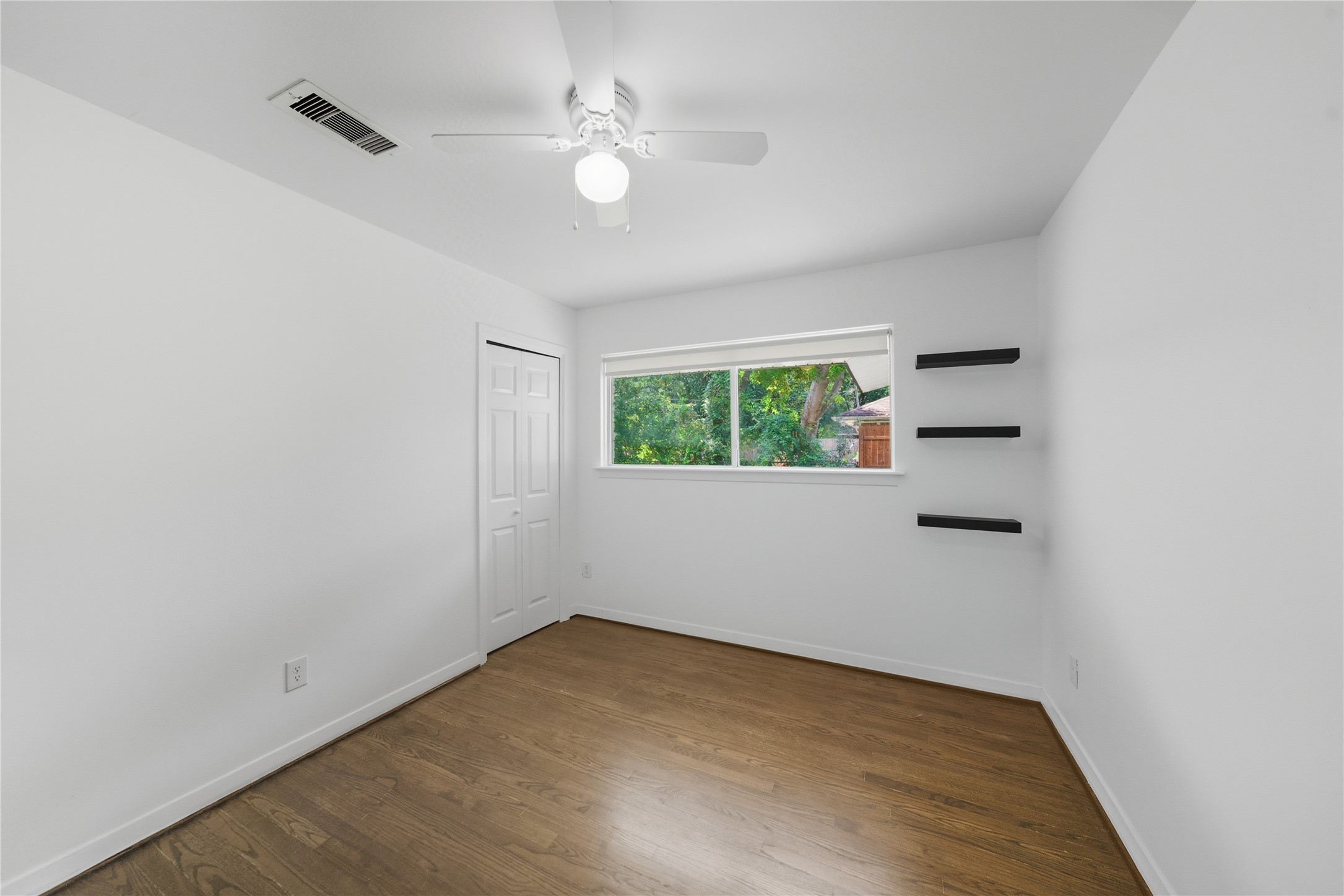 11223 Greenwillow Street Houston, TX 77035 - Photo 17 of 29 an empty room with a window