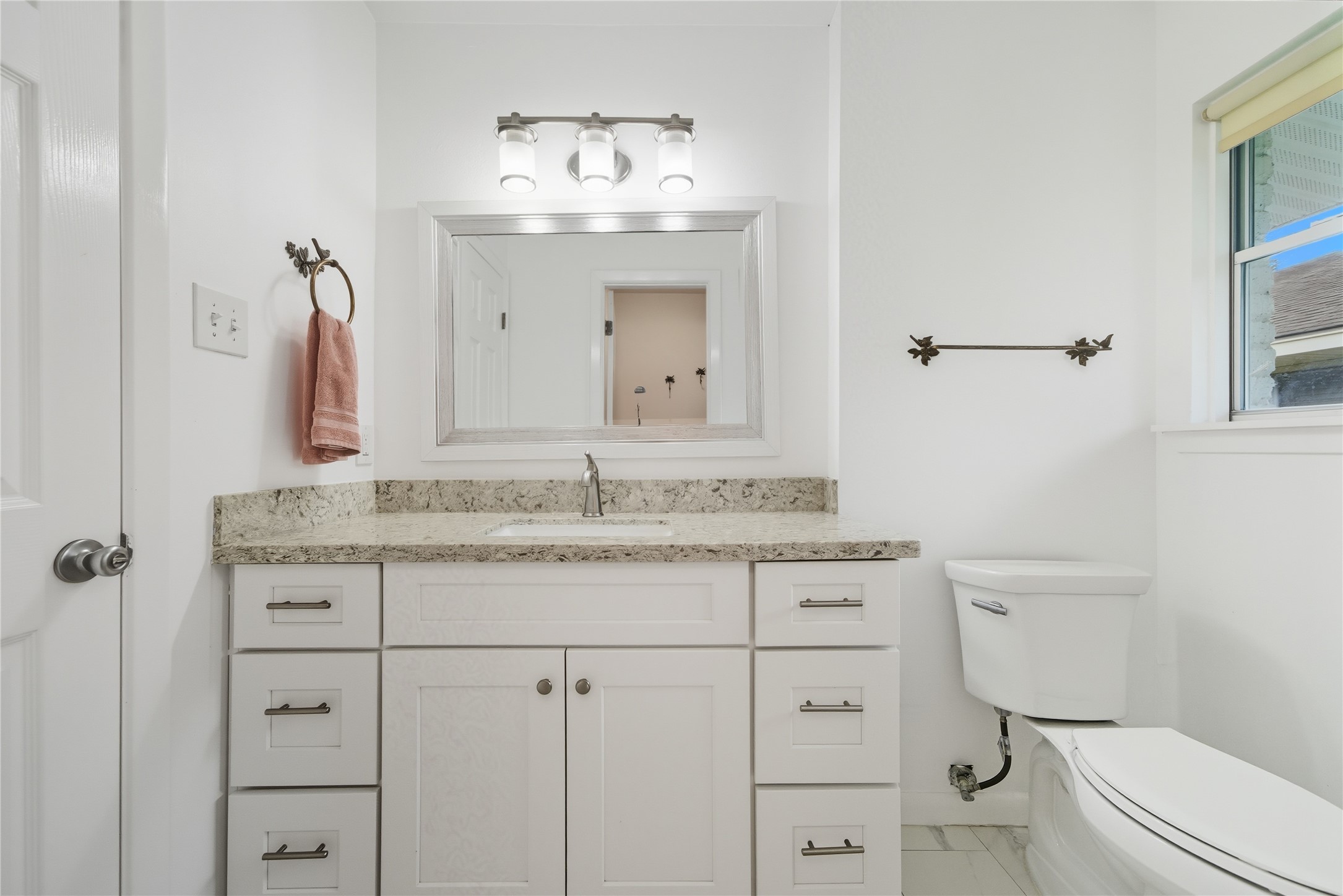 11223 Greenwillow Street Houston, TX 77035 - Photo 20 of 29 a bathroom with a granite countertop toilet sink and mirror