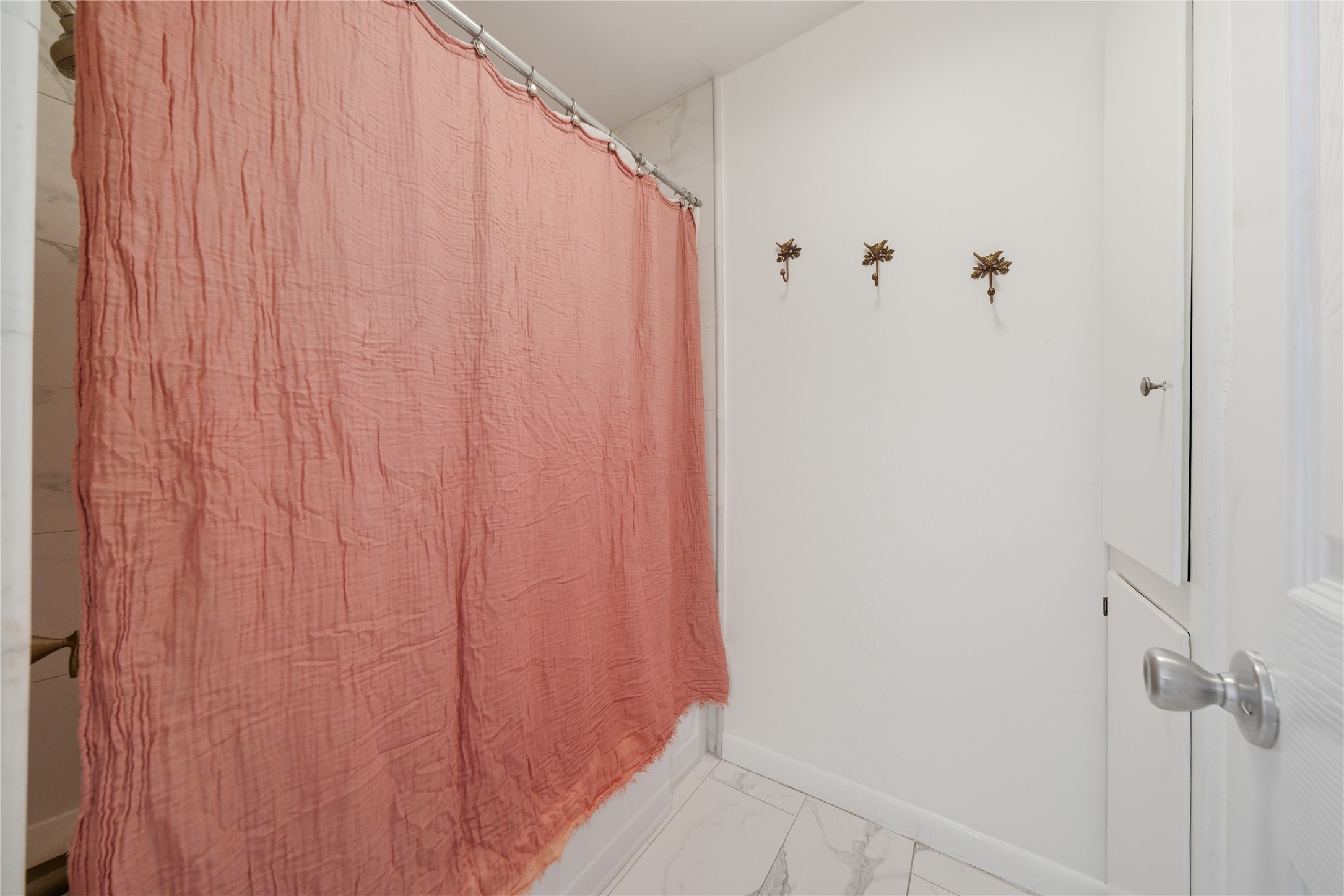 11223 Greenwillow Street Houston, TX 77035 - Photo 21 of 29 a bathroom with a shower curtain