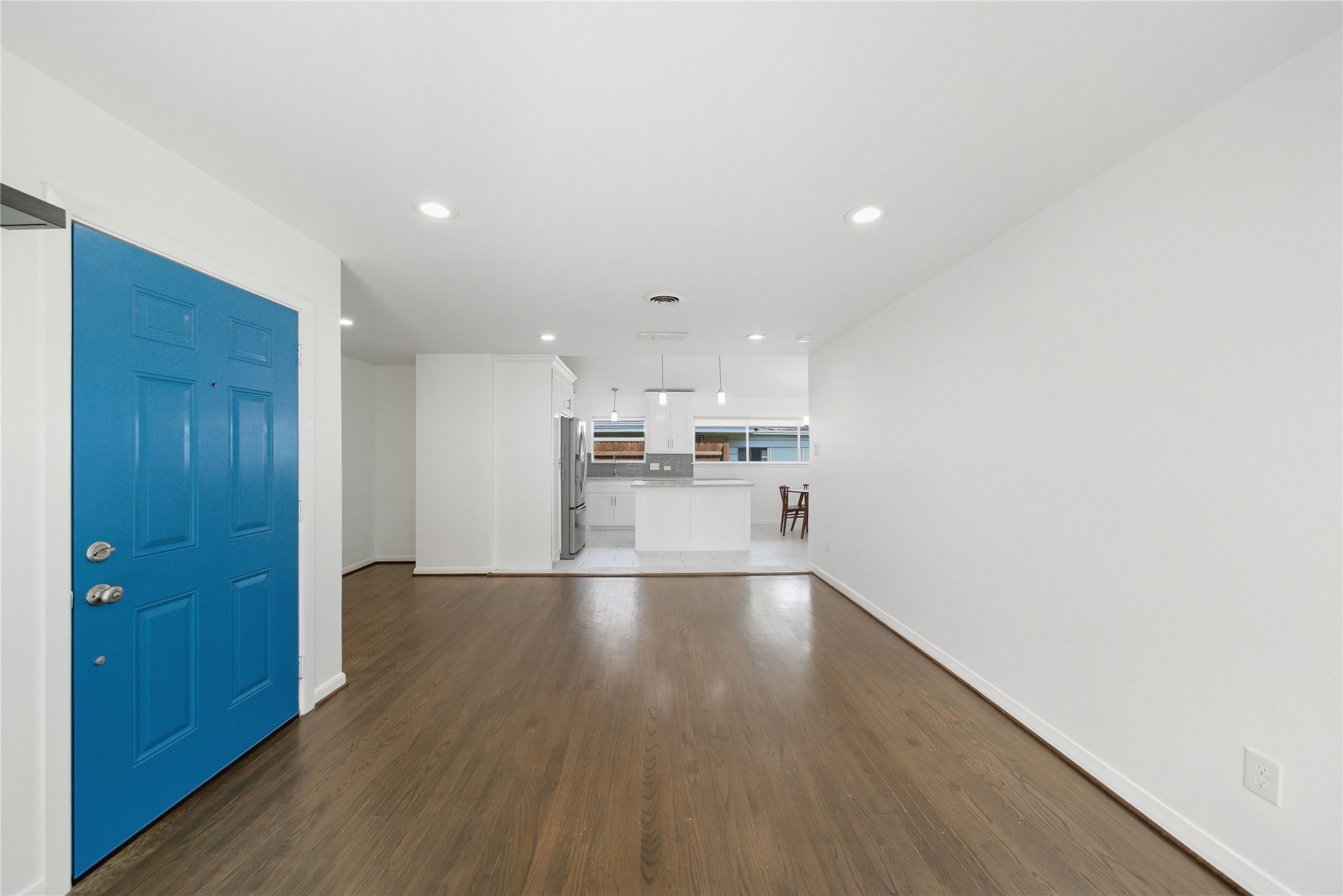11223 Greenwillow Street Houston, TX 77035 - Photo 8 of 29 a view of kitchen and hall with wooden floor