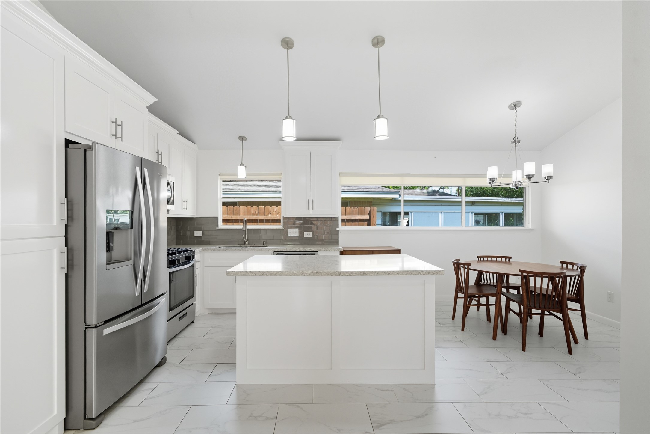 11223 Greenwillow Street Houston, TX 77035 - Photo 9 of 29 a kitchen with kitchen island a counter top space appliances and cabinets