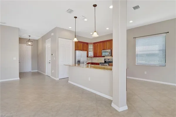 a view of a kitchen and window