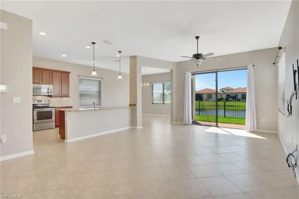 a view of a kitchen with a sink and a large window