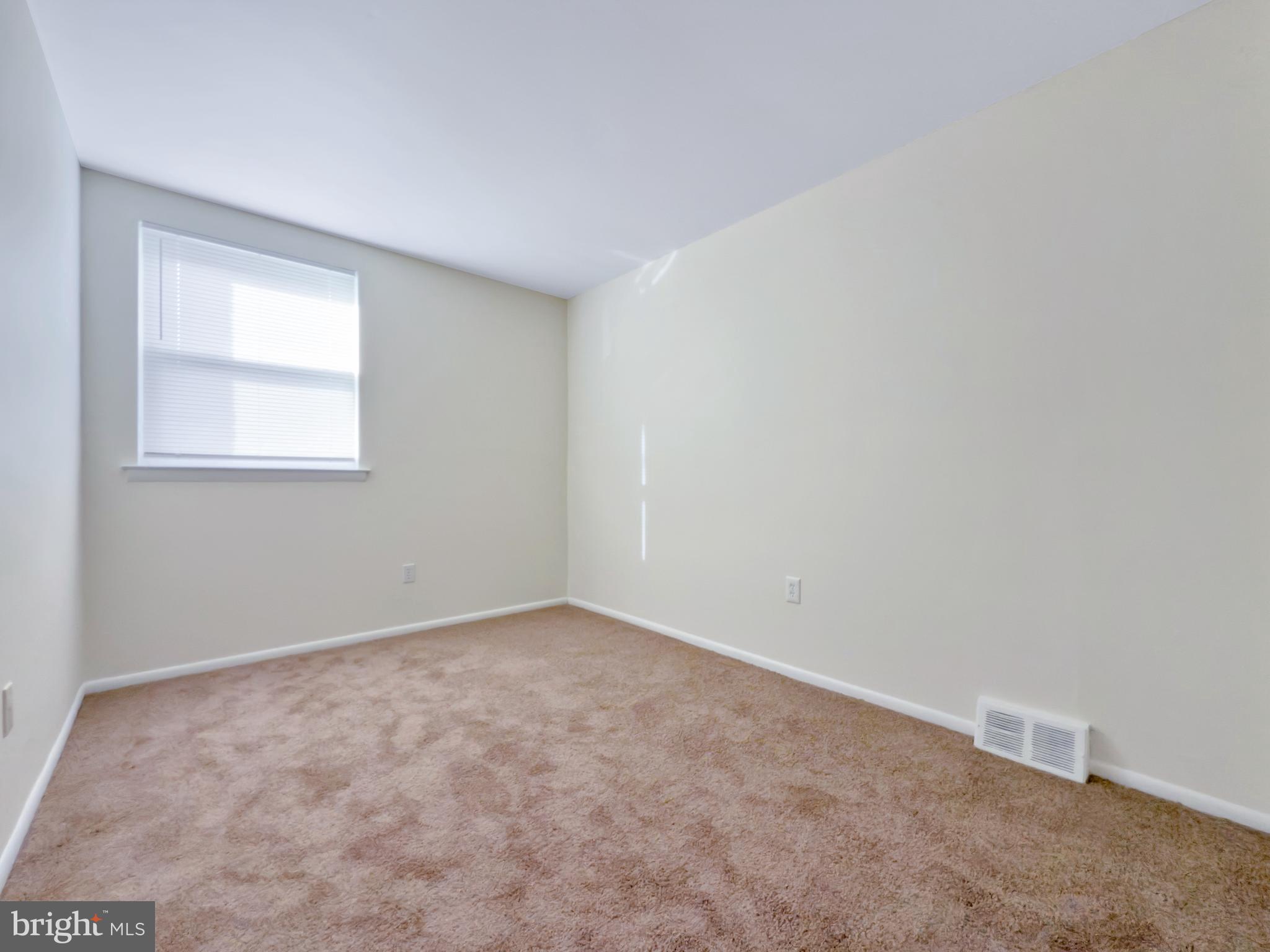 9754 East Roosevelt Boulevard, Unit 2 Philadelphia, PA 19115 - Photo 12 of 22 an empty room with a window
