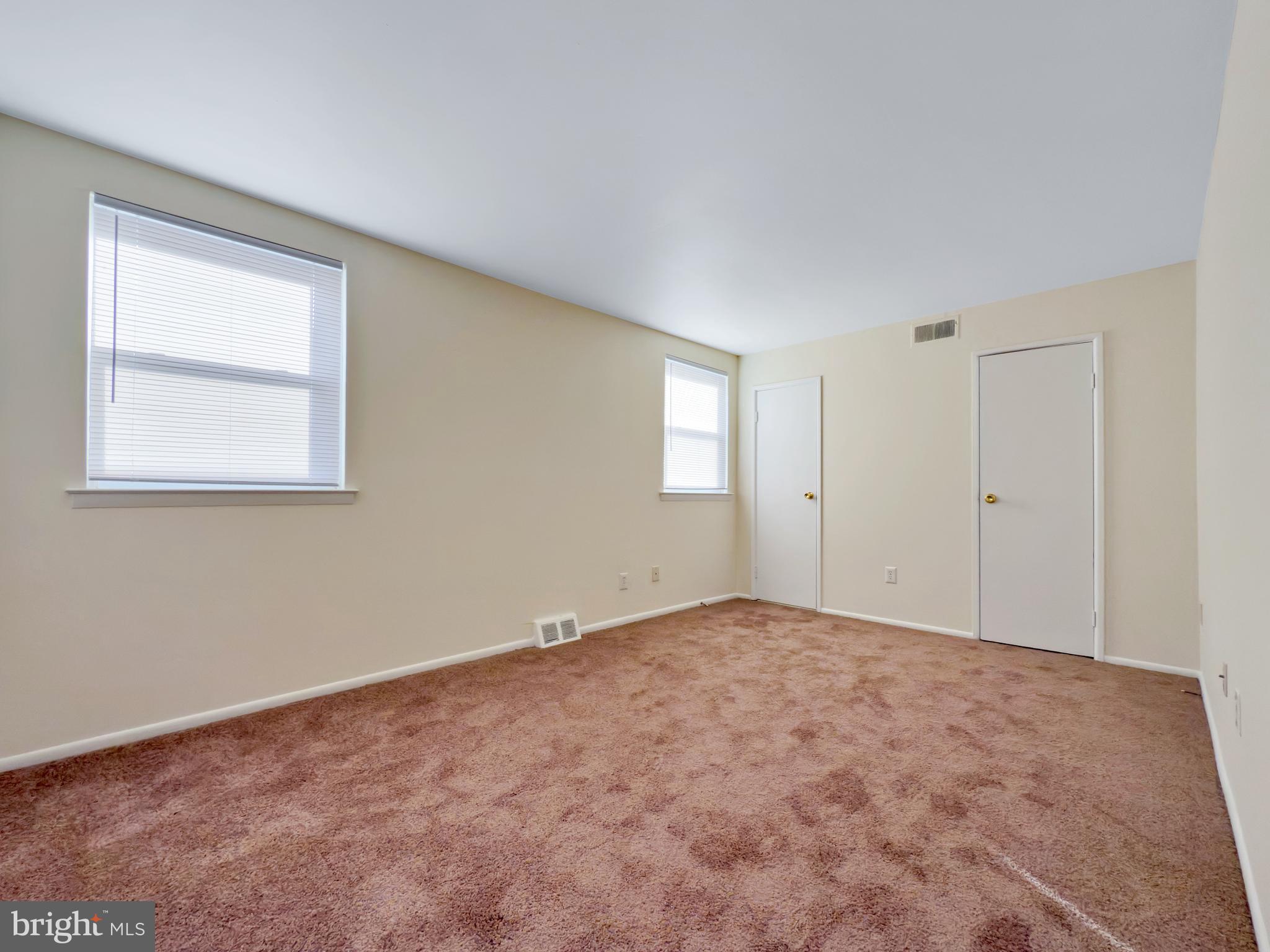 9754 East Roosevelt Boulevard, Unit 2 Philadelphia, PA 19115 - Photo 16 of 22 an empty room with windows