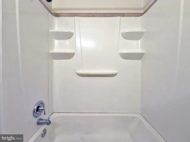 a view of a balcony with plants and a yard