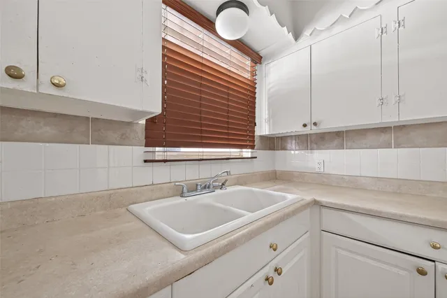 a kitchen with a stove and a microwave