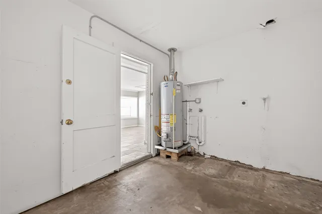 a front view of a house with a yard garage and outdoor seating