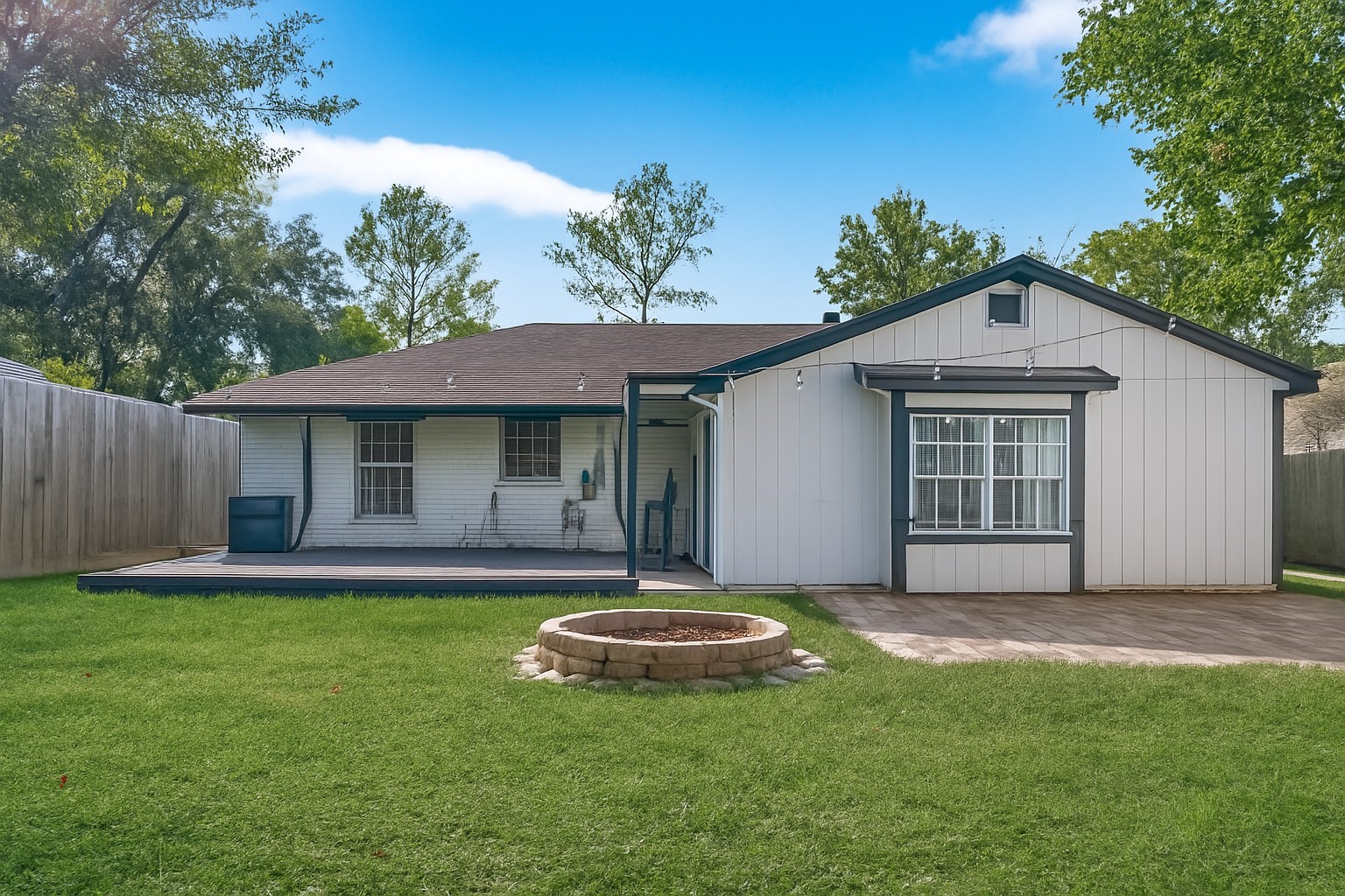 5114 West 43rd Street Houston, TX 77092 - Photo 31 of 31 a front view of a house with a yard garage and outdoor seating