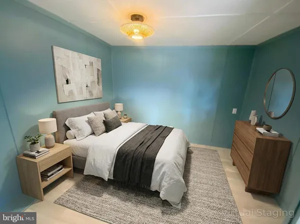 a bedroom with bed and wooden floor