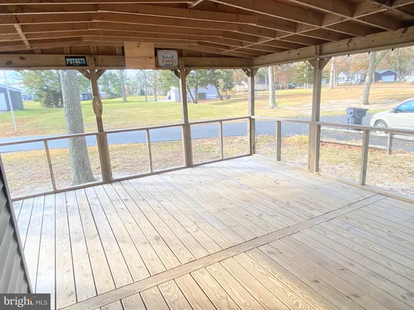 a view of porch with wooden floor