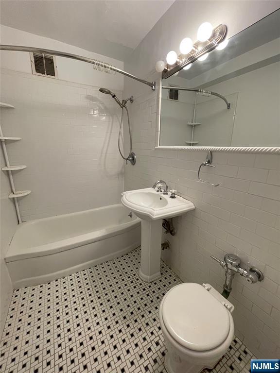 1450 Palisade Avenue, Unit 1F Fort Lee, NJ 07024 - Photo 8 of 8 a bathroom with a sink toilet and shower