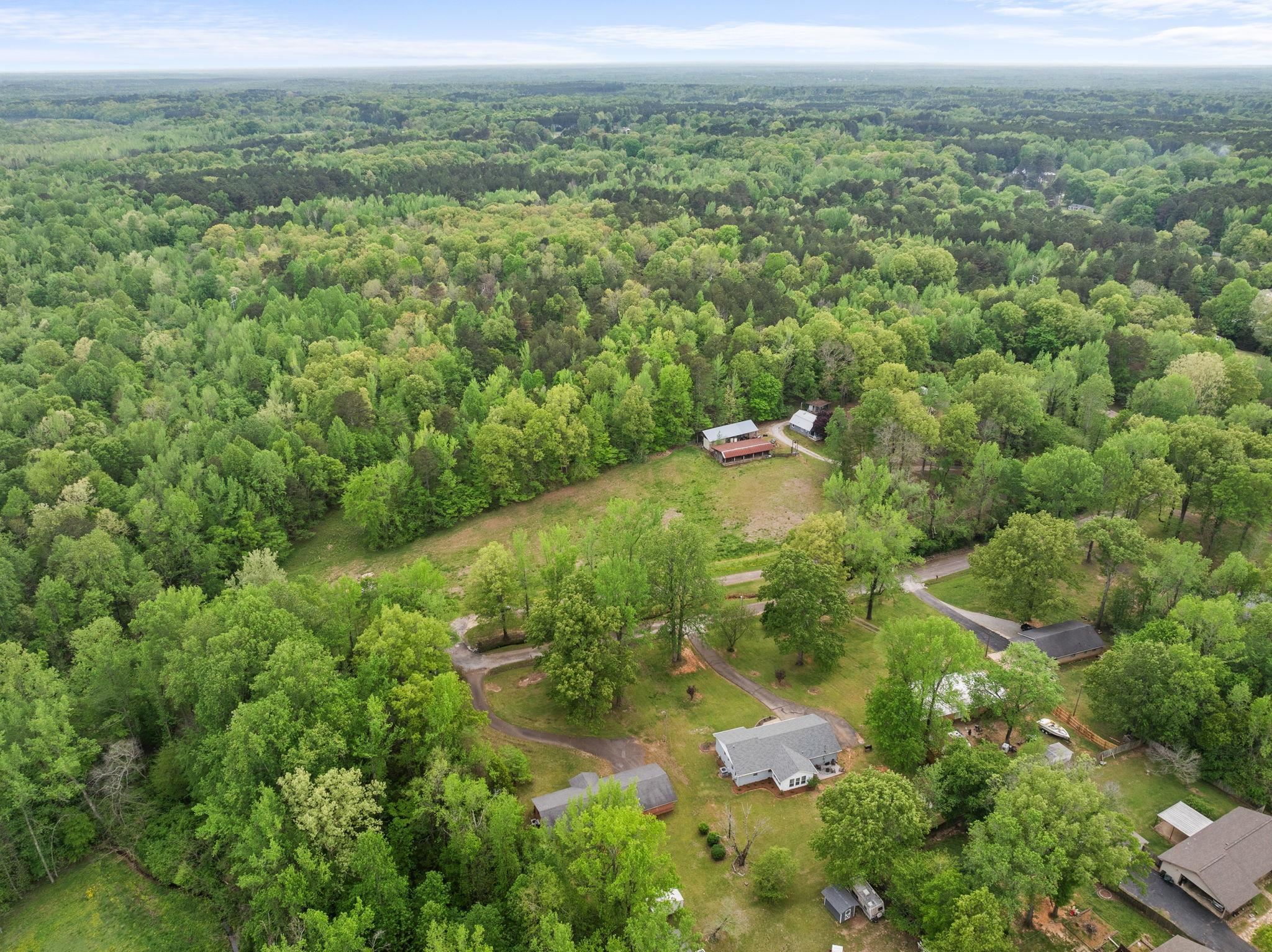 36 County Road 313 Corinth, MS 38834 - Photo 30 of 36 an aerial view of residential houses with outdoor space and trees