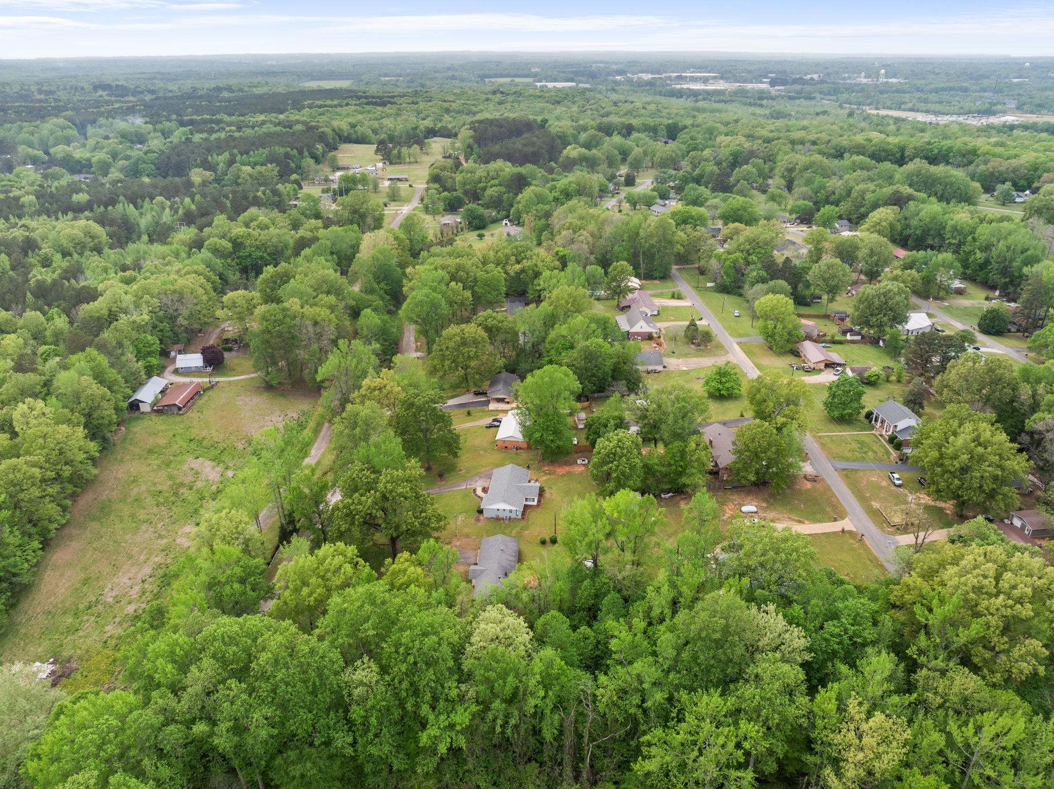 36 County Road 313 Corinth, MS 38834 - Photo 32 of 36 an aerial view of residential houses with outdoor space and trees
