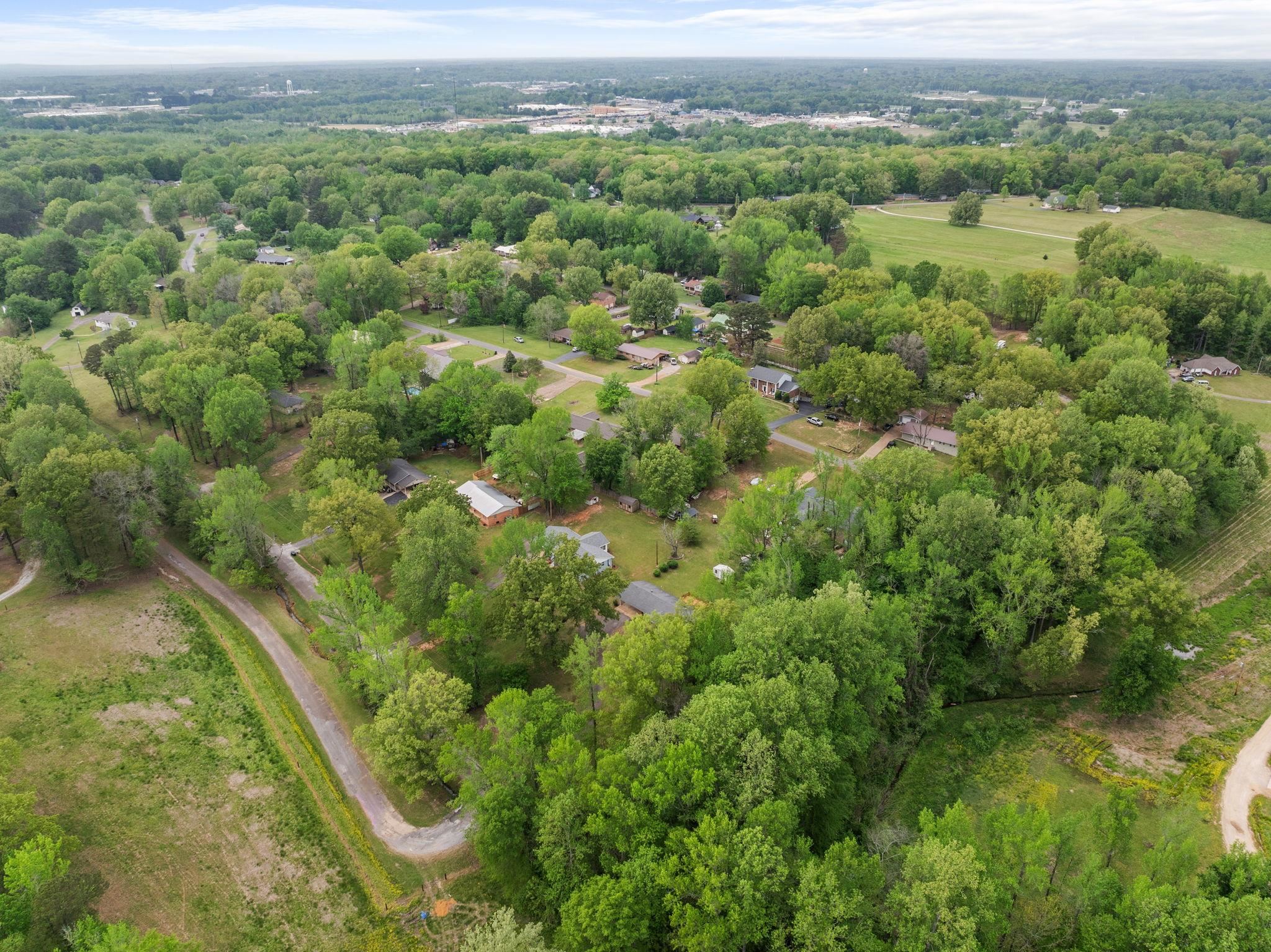 36 County Road 313 Corinth, MS 38834 - Photo 34 of 36 a view of a city and lush green forest