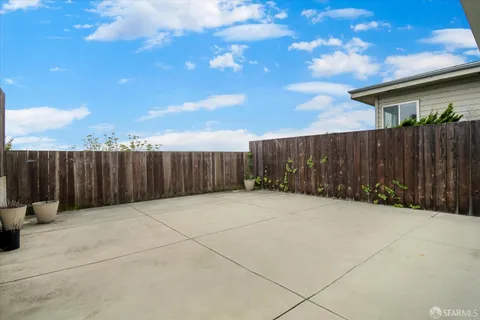 a view of basketball place with wooden fence