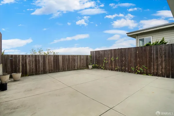 a view of basketball place with wooden fence