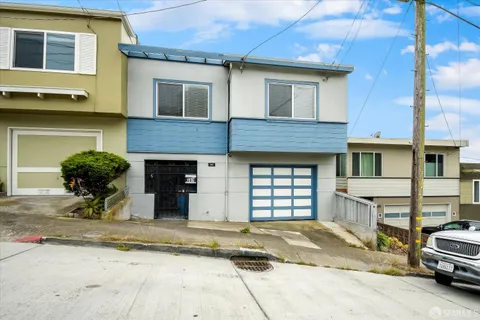 a view of a car parked in front of a house